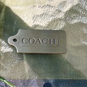 Coach metal hang tag